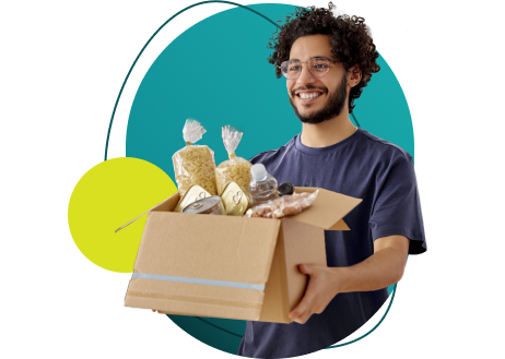 Young man carrying a box of food commodities.